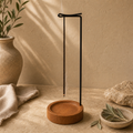 Metal and wood incense stand styled for a home incense ritual
