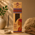 Box of Sacred Elements Musk incense with an incense stick and decorative elements on a warm-toned background