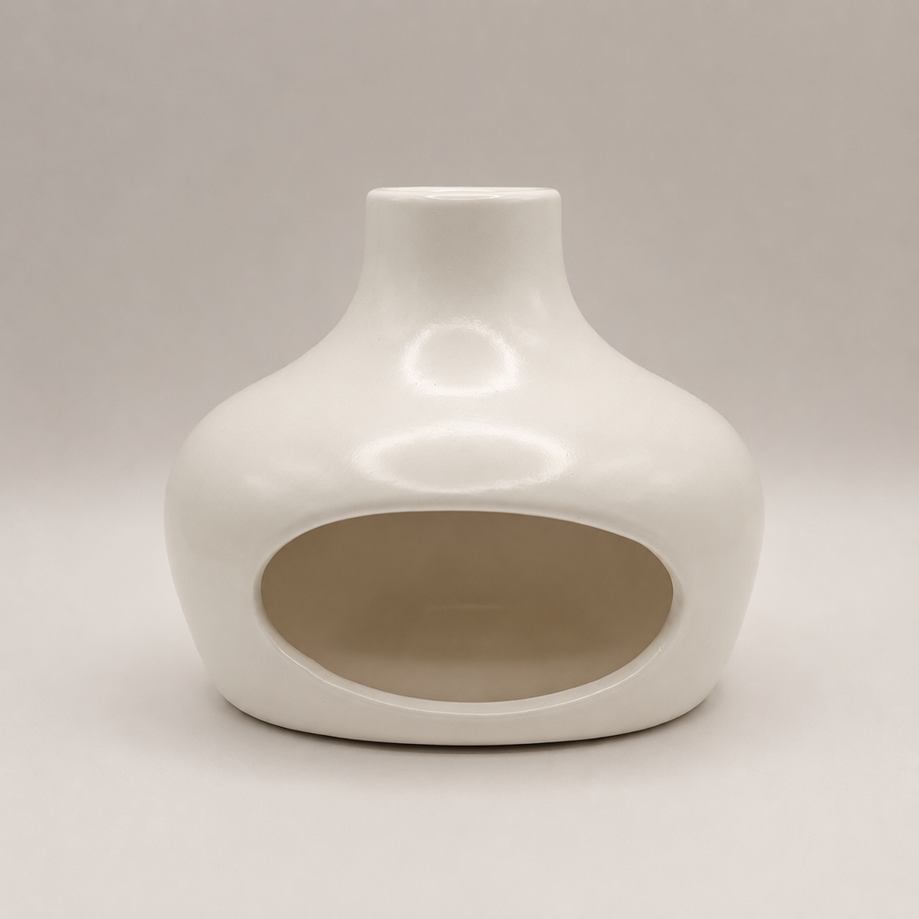 White ceramic vase on a light gray background