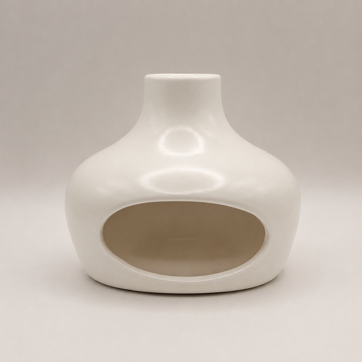 White ceramic vase on a light gray background