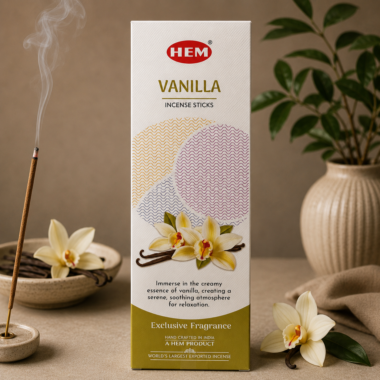Box of HEM Vanilla incense sticks with incense burning and vanilla flowers on a table.